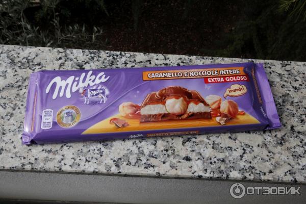 Шоколад молочный Milka с молочной и карамельной начинками и цельным фундуком фото