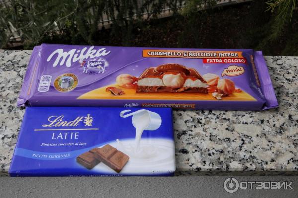 Шоколад молочный Milka с молочной и карамельной начинками и цельным фундуком фото