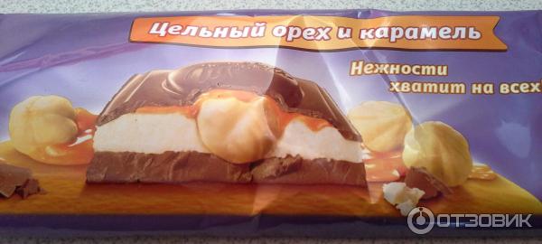 Шоколад молочный Milka с молочной и карамельной начинками и цельным фундуком фото