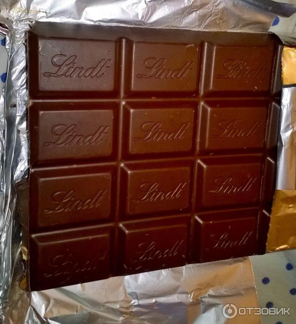 Швейцарский темный шоколад с апельсином и миндалем Lindt фото