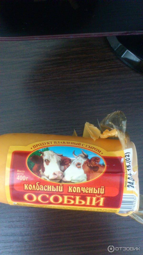 Продукт сырный колбасный копченый Особый в парафине фото