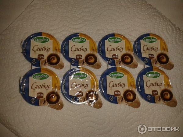 Сливки порционные Campina 10% фото