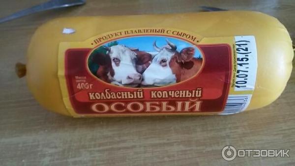 Продукт сырный колбасный копченый Особый в парафине фото